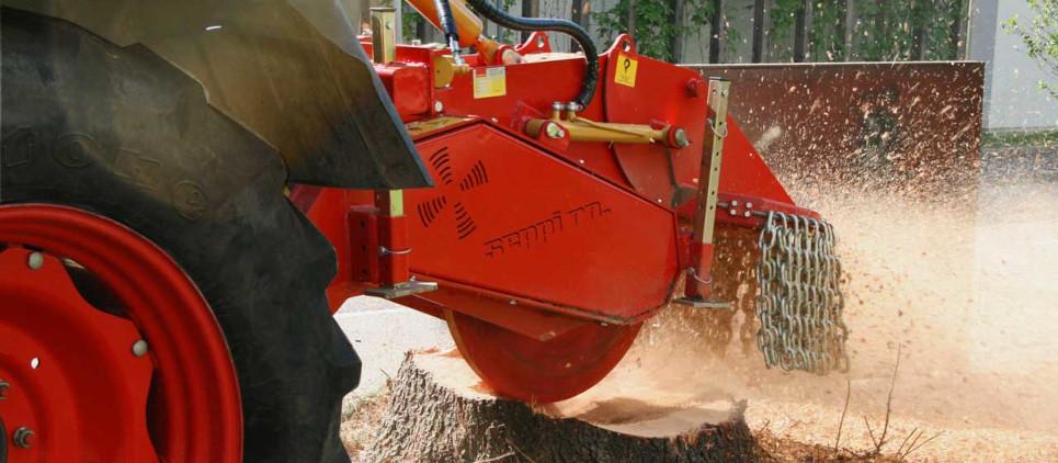 Stump grinder with rotating cutting disk.